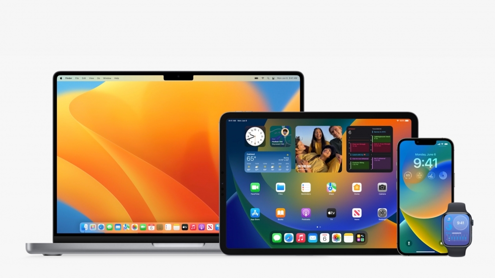 Apple devices compatible with macOS 26 including MacBook, iPad, iPhone, and Apple Watch