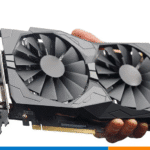 Close-up of a dual-fan desktop graphics card held in hand during a pre-purchase inspection. The image highlights GPU cooling fans, PCIe connector, and I/O ports — relevant for used GPU testing and safe buying checks in Europe.