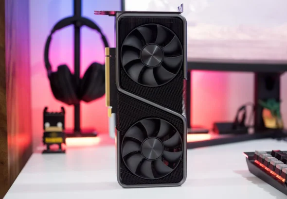 Close-up product-style photo of a dual-fan NVIDIA GeForce RTX graphics card standing vertically on a desk, with a PC setup background—ideal for GPU pricing, used GPU buying guides, and PC hardware articles.